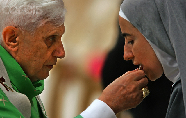 Priest Giving Communion